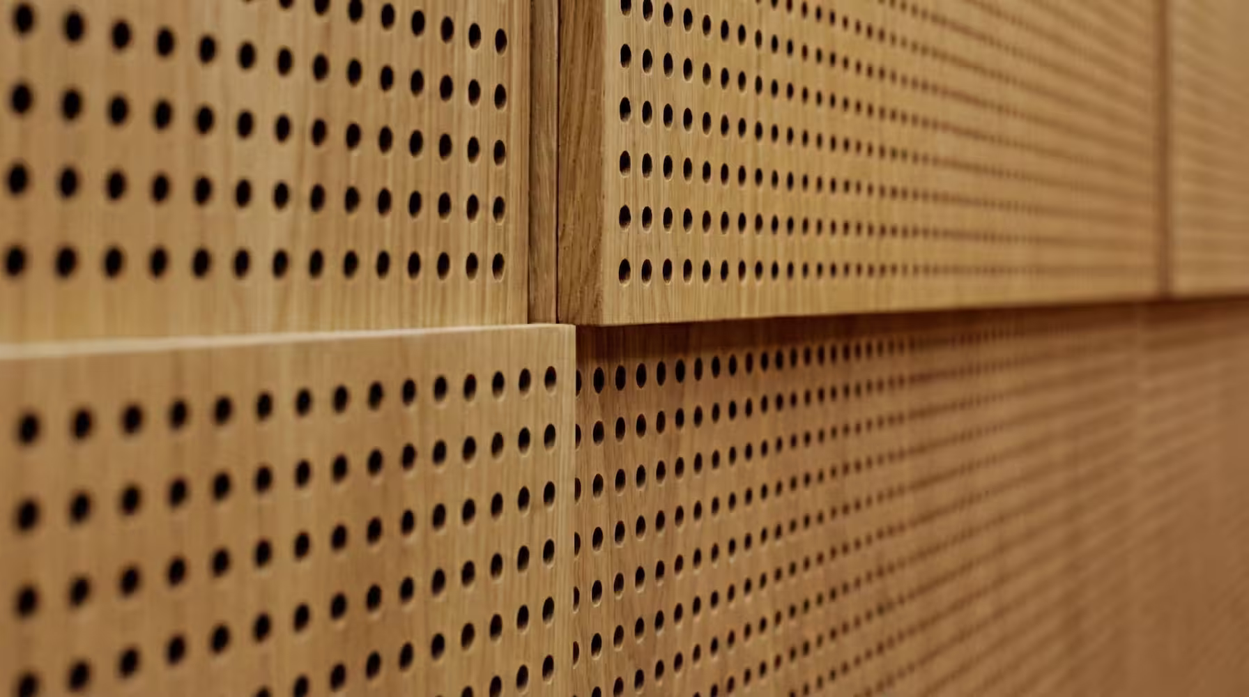 Perforated acoustic wood panels application — echo control and aesthetic wood appearance in modern interiors