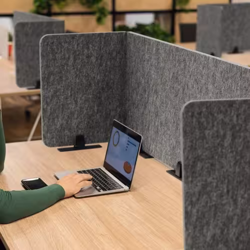 Fabric-covered acoustic felt desk divider detail — fabric texture and clean finish
